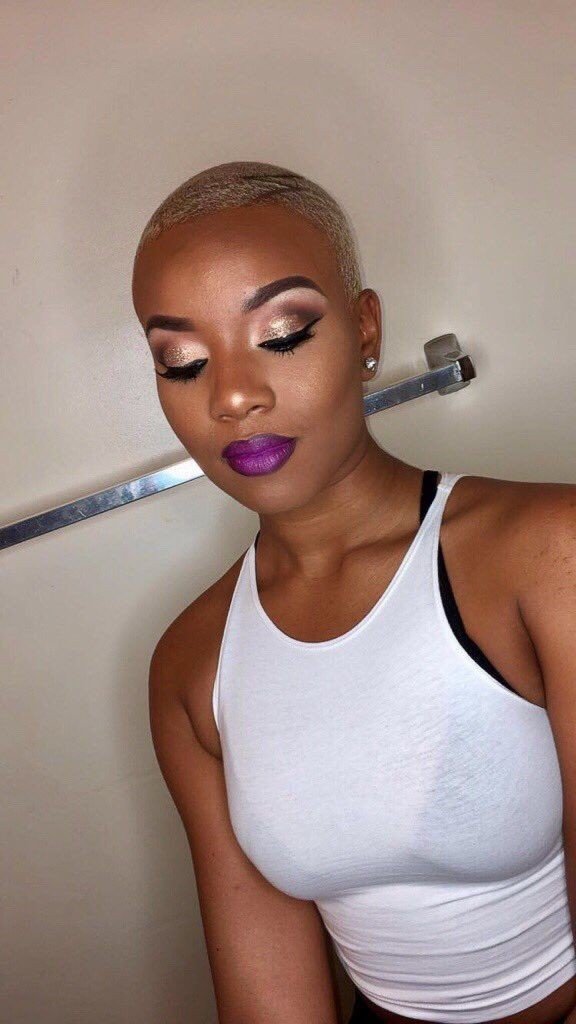 Buzz haircut with bold makeup